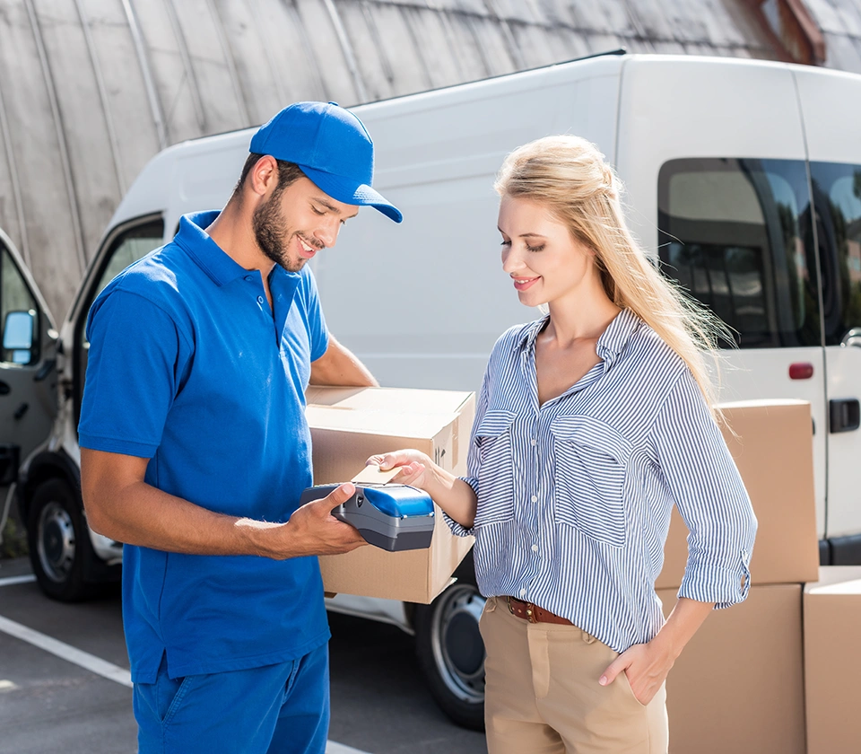 Courier-delivery-man-giving-parcel-to-a-woman