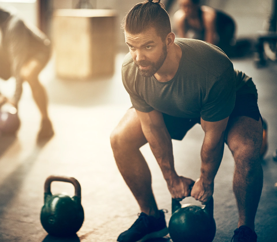 man-exercising-with-kettlebell