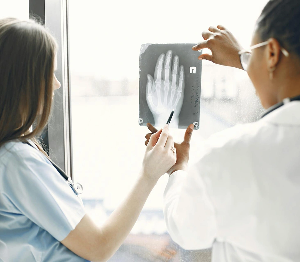 orthopedic-doctors-looking-at-palm-x-ray