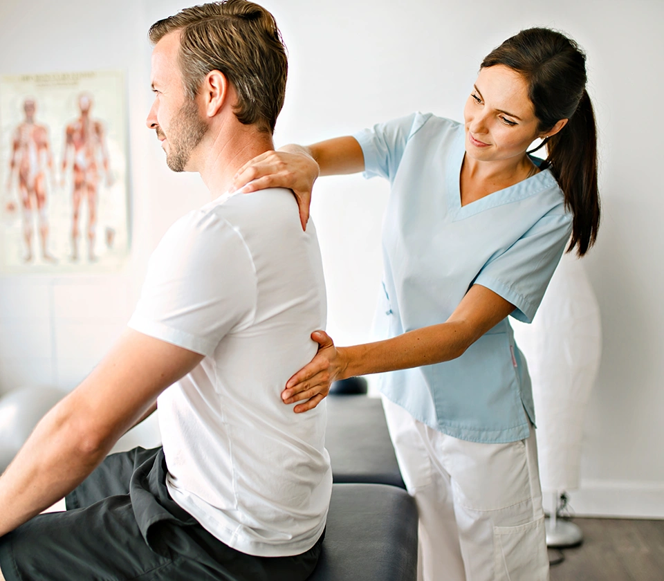 woman-chiropractor-adjusting-back