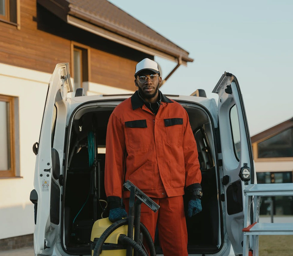 cleaning-guy-standing-with-vacuum-cleaner