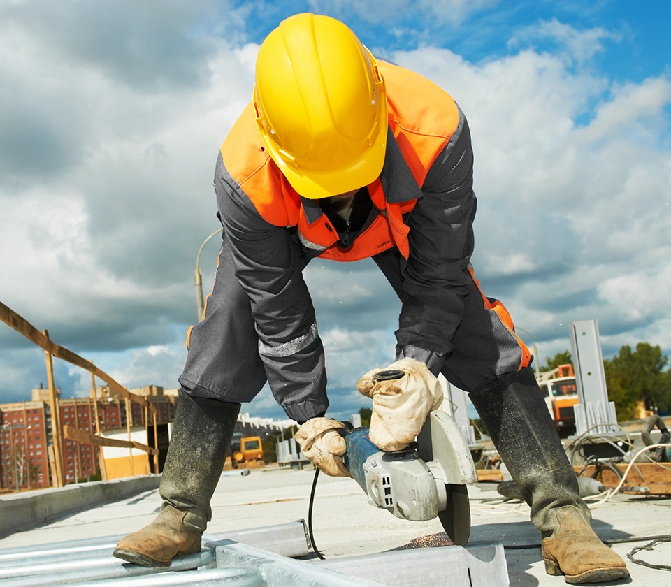 construction-worker-cutting-metal-sheet