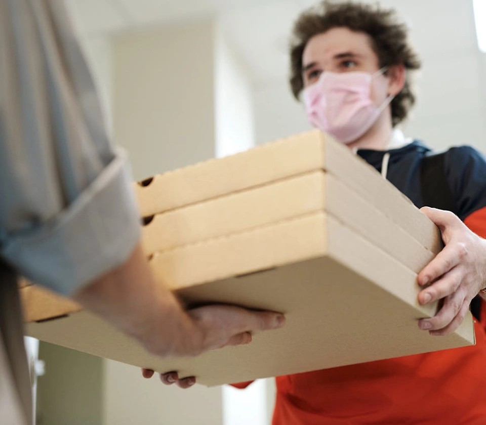 food-delivery-guy-giving-food-boxes-to-a-customer