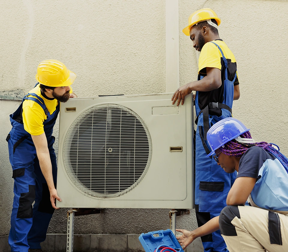 team-replacing-old-air-conditioner