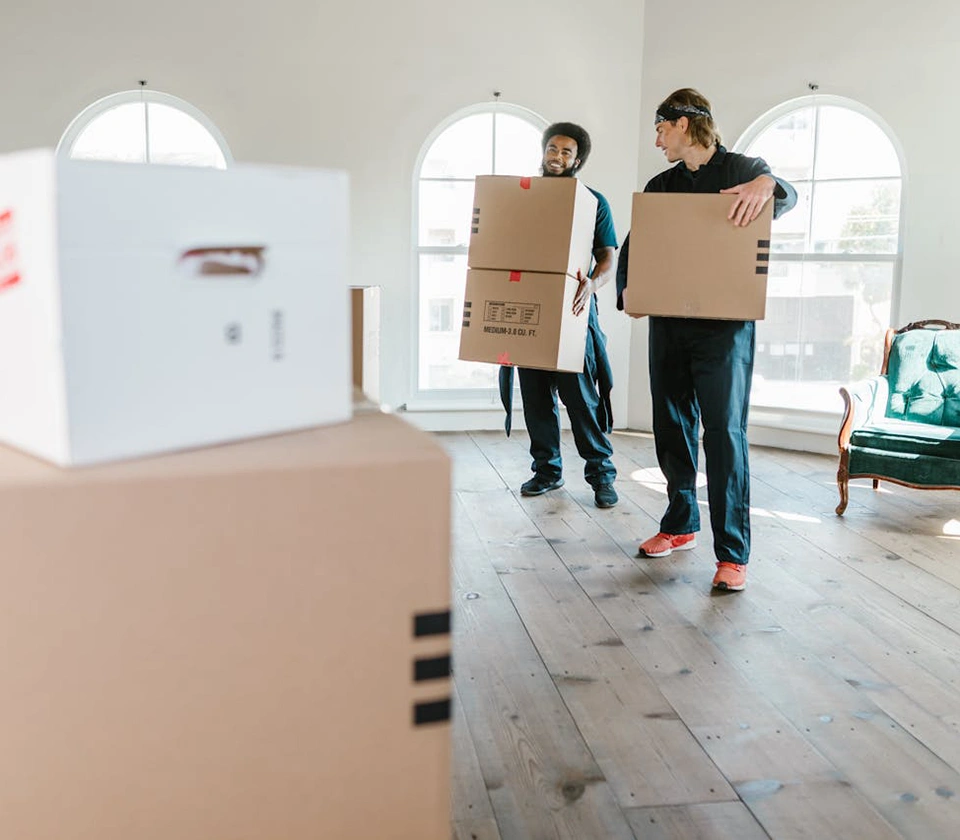 two-guys-moving-boxes-of-the-customer